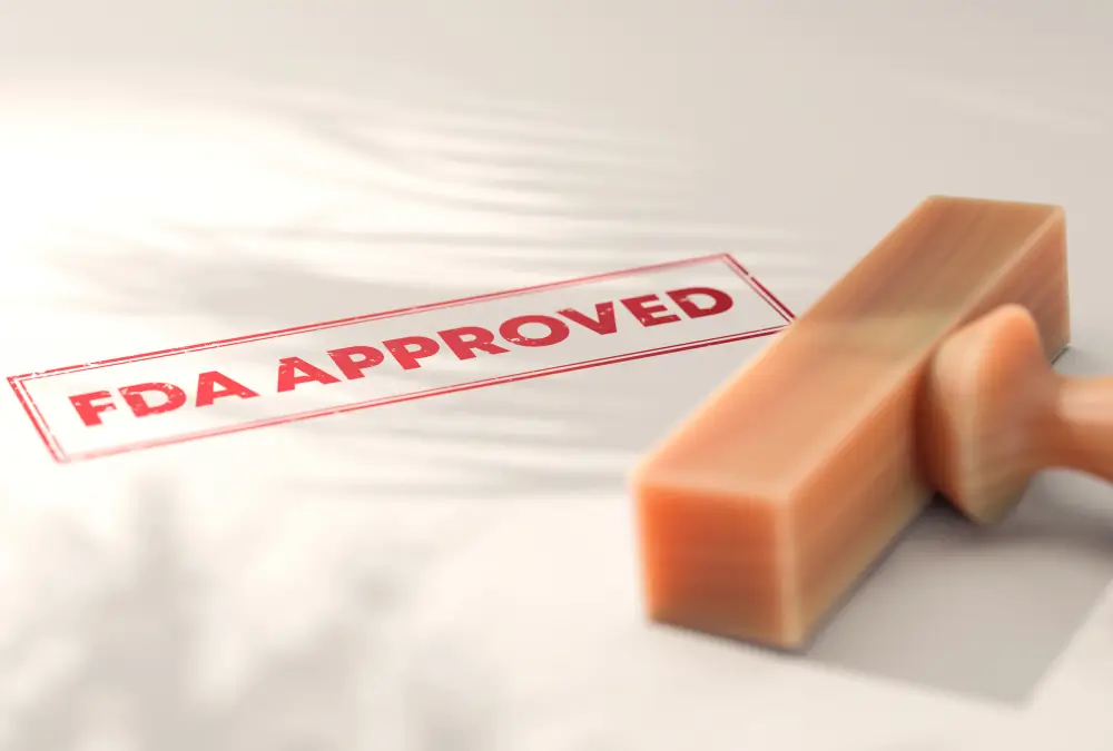 FDA approved stamp on paper surface.